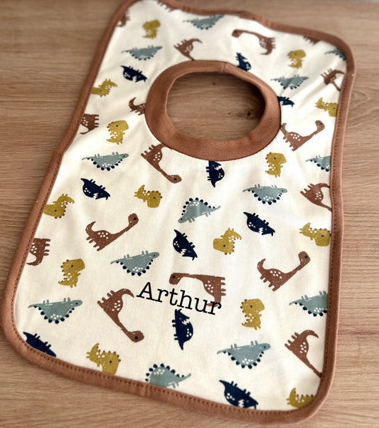 Bavoir à motifs léopard ou dinosaure